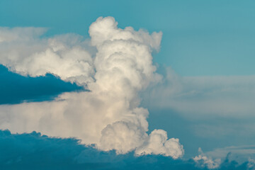 Cumulonimbus is a dense, towering vertical cloud, Towering cumulonimbus clouds are typically accompanied by smaller cumulus clouds. Honolulu Oahu Hawaii