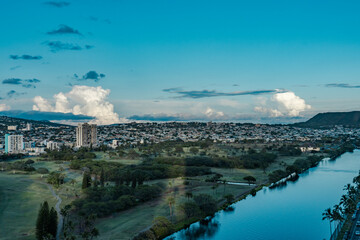 Fototapeta premium Kaimiki / Kapahulu / Ala Wai Golf Course, Cumulonimbus is a dense, towering vertical cloud, Towering cumulonimbus clouds are typically accompanied by smaller cumulus clouds. Honolulu Oahu Hawaii