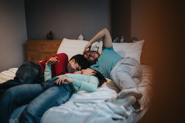 A group of friends unwind on a bed, showcasing bonding and comfort in a casual setting.