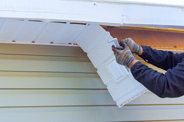 As part of remodeling process, house master repairs fascia trim that was damaged