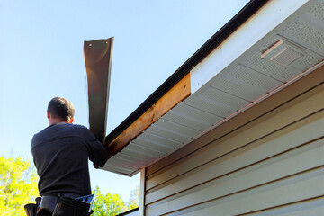 As part of remodel, master makes repairs to fascia trim that had been damaged