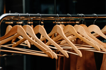 wooden clothes hangers hang on mobile wardrobe