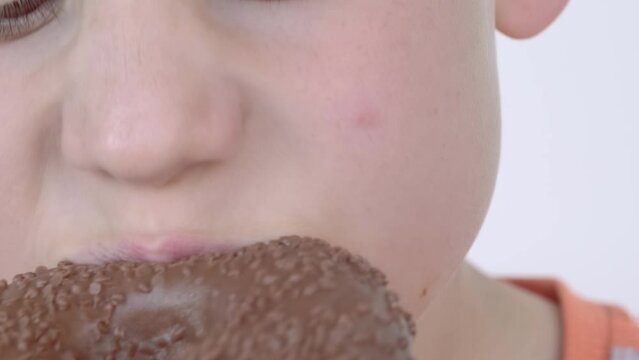 male teenager eating chocolate bar, boy 10 years old enjoys delicious chocolate bar, child eating sugary snack, unhealthy delicious sweetness, Childhood memories, sweet treat, little moments joy