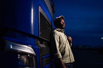 Hardworking truck driver preparing for night shift drive.