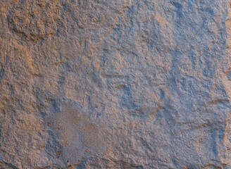 Obraz premium Orange and Blue Stone Wall with Texture and Detail.