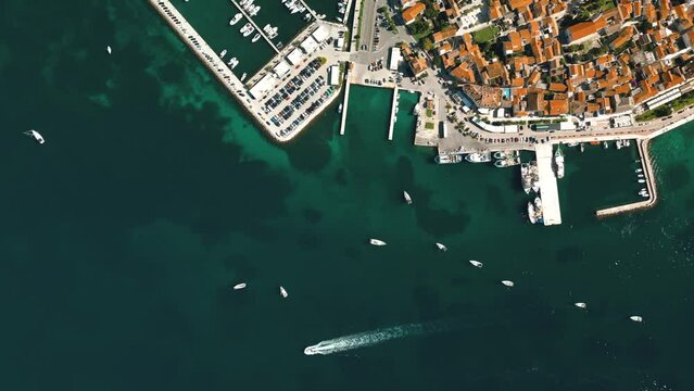 Biograd na Moru, aerial above view of city port with beautiful architecture and sailing boats and luxury yachts at stone pier. Scenic historic harbor on Adriatic Sea coast, Dalmatia region in Croatia