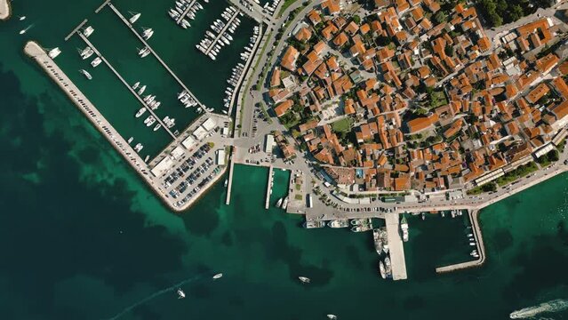 Biograd na Moru, aerial above marina view with ships and yachts at pier in row. Old European architecture in summer port, travel destination on Adriatic Sea coast, Dalmatia region of Croatia