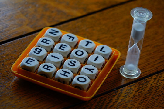 Jumbled up letters in a board game matrix with a salt timer