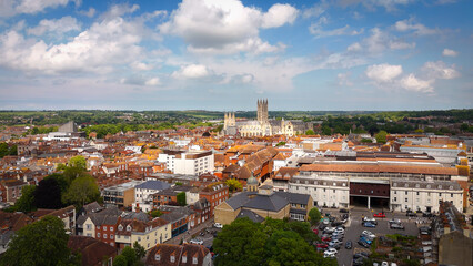Flight over the city of Canterbury United Kingdom with famous Canterbury Cathedral on a sunny day -...