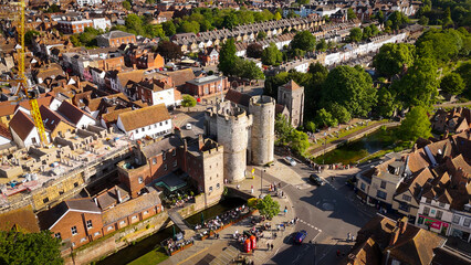 Flight over the Westgate Towers of Canterbury at the historic city centre - aerial drone photography