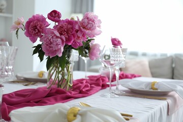 Beautiful table setting with pink peonies in dining room