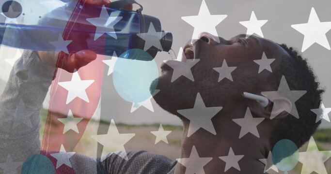 Image of american flag over african american man drinking water in mountains - Powered by Adobe
