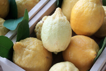 fresh lemons in wooden box