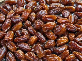 dates close up. date palm background. Date palm on a traditional craftsman market.Horizontal image.