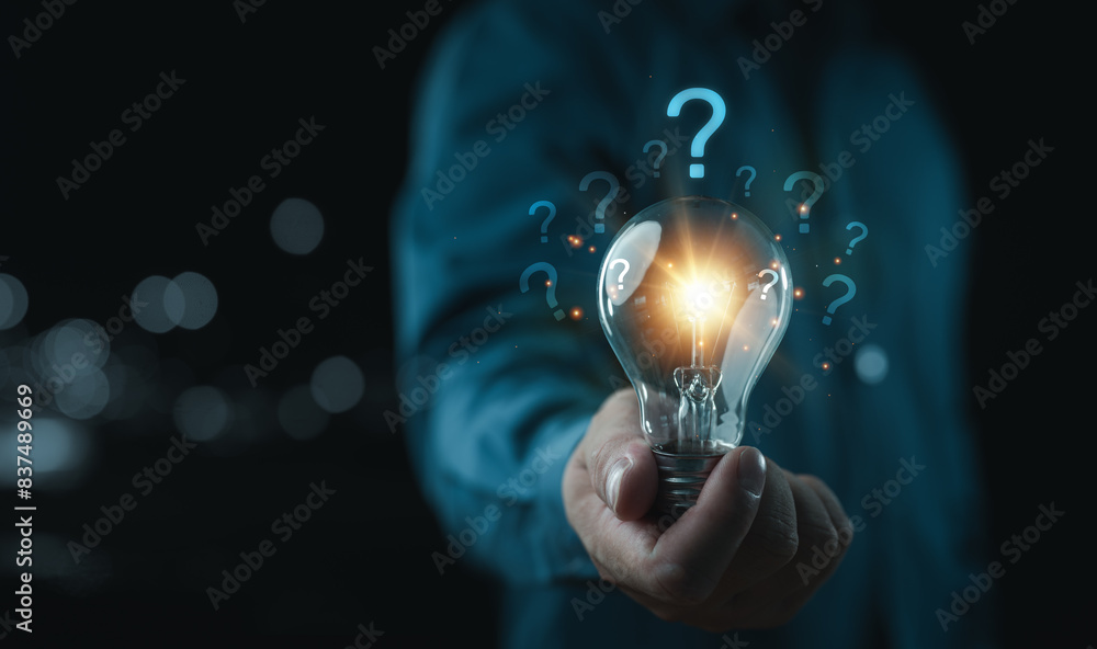 Aufkleber businessman holding glowing lightbulb and question mark with copy space for creative thinking idea a
