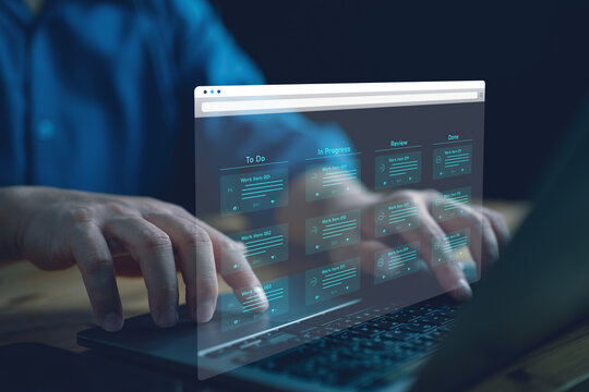 Agile software development or project management using kanban or scrum methodology boards on screen. Process, workflow, visual organization tools and framework. Developer touching virtual interface.