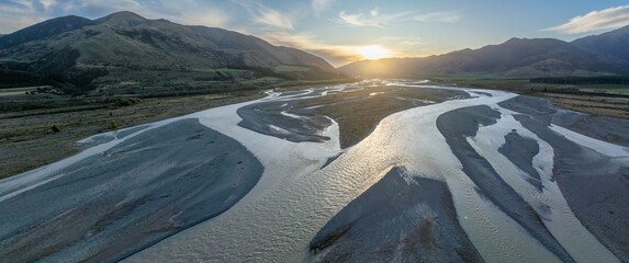 The Waiau Uwha river and mountain range at sunset. Hanmer Springs, Culverden, Canterbury, New...