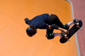 Skateboarder getting air © PixilRay