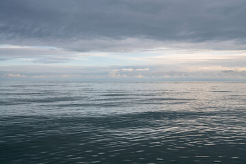 Fototapeta premium View of the Black Sea on the coast of Sochi against the sunset sky, Sochi, Krasnodar Krai, Russia