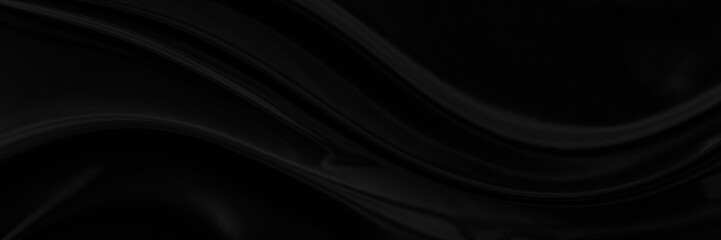 Black gray satin dark fabric texture luxurious shiny that is abstract silk cloth panorama background with patterns soft waves blur beautiful.