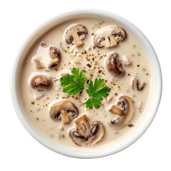 Creamy mushroom soup in a white ceramic bowl, garnished with fresh parsley, black pepper, and sliced mushrooms, photographed on a transparent background.
