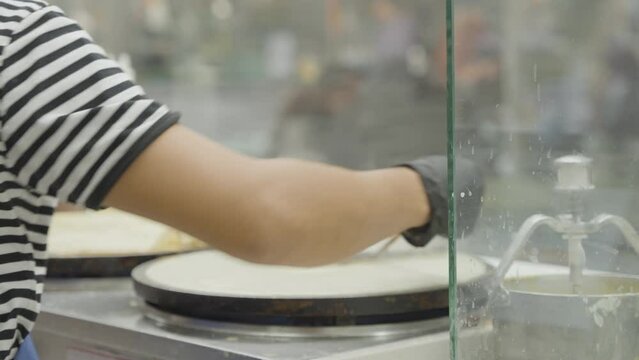 Close up on a crepe being made.