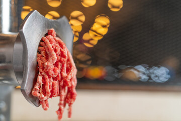 Pressing ground beef using a machine