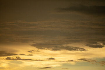 Golden Skies and Ethereal Clouds: A Stunning Natural Scene Captured in Perfect Light for Your Creative Needs