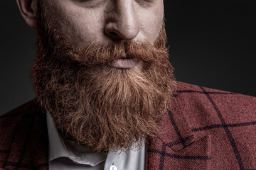 Brutal elegant man with red beard. Masculine formal menswear. Bearded man with moustache isolated...