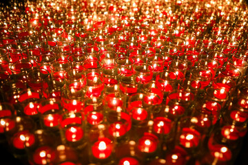 A Mesmerizing Sea of Red Candle Flames Illuminating the Night in a Stunning Display of Light