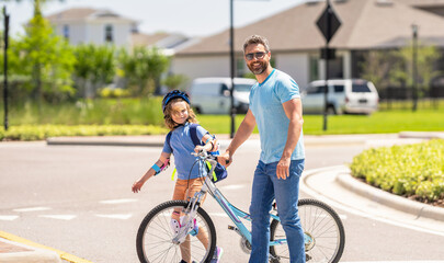 Obraz premium father and son on bicycle at fathers day. active father setting a example for fathers son. fathers parenting with son outdoor. childhood of son supported by fathers care. Nurturing relationship