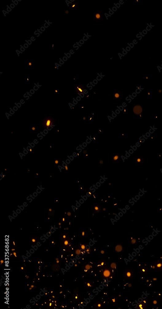 Poster seamless loop random flying fire sparks on clean black vertical copy space animation background.
