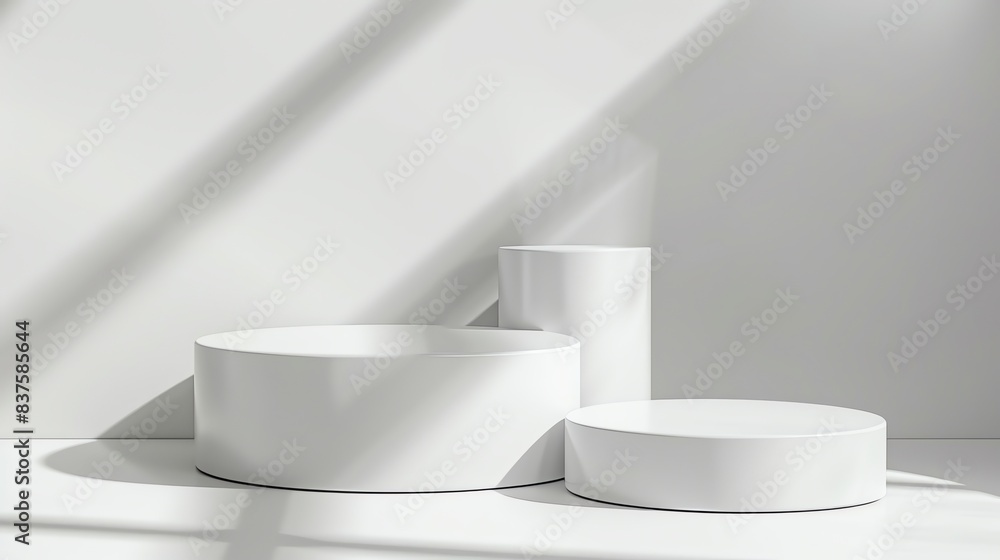 Fototapete 3D rendering of a simple and clean product display. Three white cylinders of different sizes sit on a white surface against a white background.