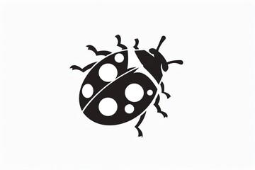 Obraz premium Black and white silhouette of a ladybug with white spots.