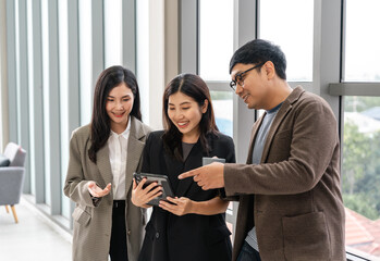 Asian business start up freelance people team analyzing statistics financial. Group Team of businesspeople man and woman Meeting Conference Discussion various topic Corporate Concept in office.