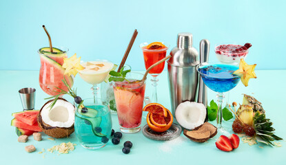 Summer colorful cocktails on blue background. Fresh tasty tropical drinks