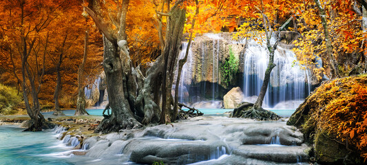Amazing in nature, beautiful waterfall at colorful autumn forest in fall season	