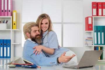Obraz premium Sexy Woman and business man Sexual Harassment In Office. Sexy young employee Sexual Harassment. Female abuse. Employee Sexually harassed. Sex at work. Couple in love in business office.