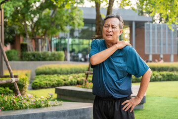 Fototapeta premium Senior asian old man with sportswear has an inflamed neck and shoulder pain. Old man senior has problem with structural posture