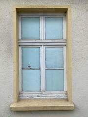 Old window whose panes have been made invisible from the inside with a frosted glass cover