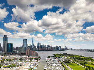 Marine in New York City Skyline with Urban Skyscrapers and yachts. New York City skyline, cityscape of Manhattan in USA. Panoramic view on Manhattan. New York Harbor.