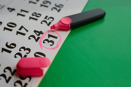 Calendar with marker marking 31st day, end of month, last day of the year