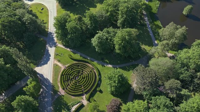 Tourists wander through the maze at Slottsskogen Labyrinth in the center of Gothenburg, Sweden