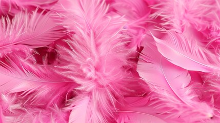 Obraz premium A multitude of pink feathers scattered randomly for a wallpaper background or backdrop