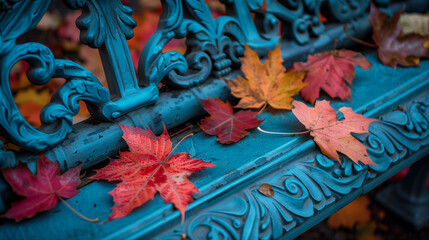 Autumn Tranquility. A serene scene of vibrant red and orange maple leaves resting on a blue wooden bench, capturing the essence of fall.