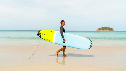Confidence Asian man enjoy outdoor active lifestyle water sports surfing on summer holiday...