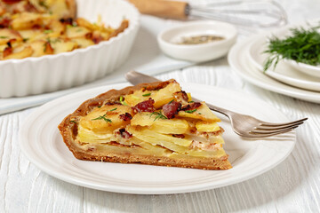 Irish potato pie with bacon on white plate