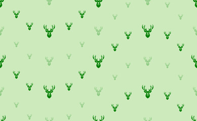 Seamless pattern of large and small green deer head symbols. The elements are arranged in a wavy. Vector illustration on light green background