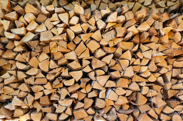 Lots of stacked firewood in Swedish garden