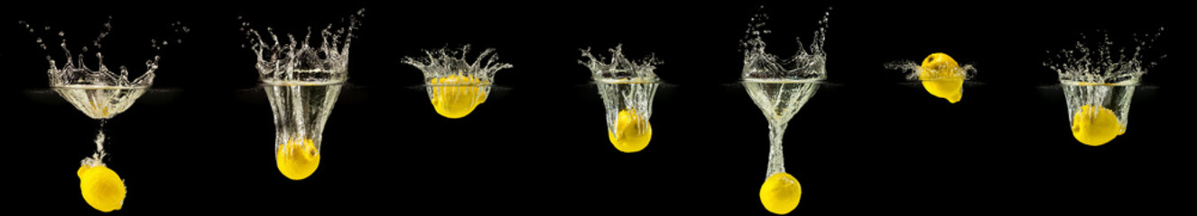 Group of fresh lemon fruits falling in water with splash on black background